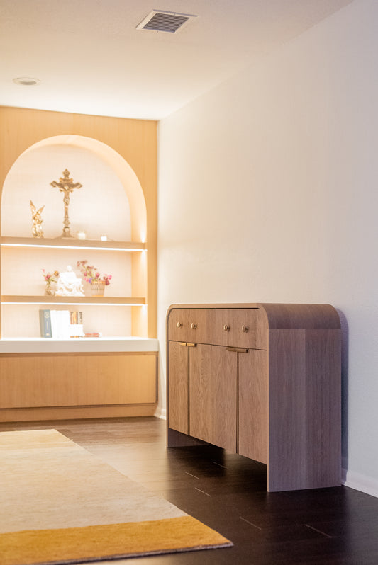 White oak wood console table with brass hardware and reeded doors